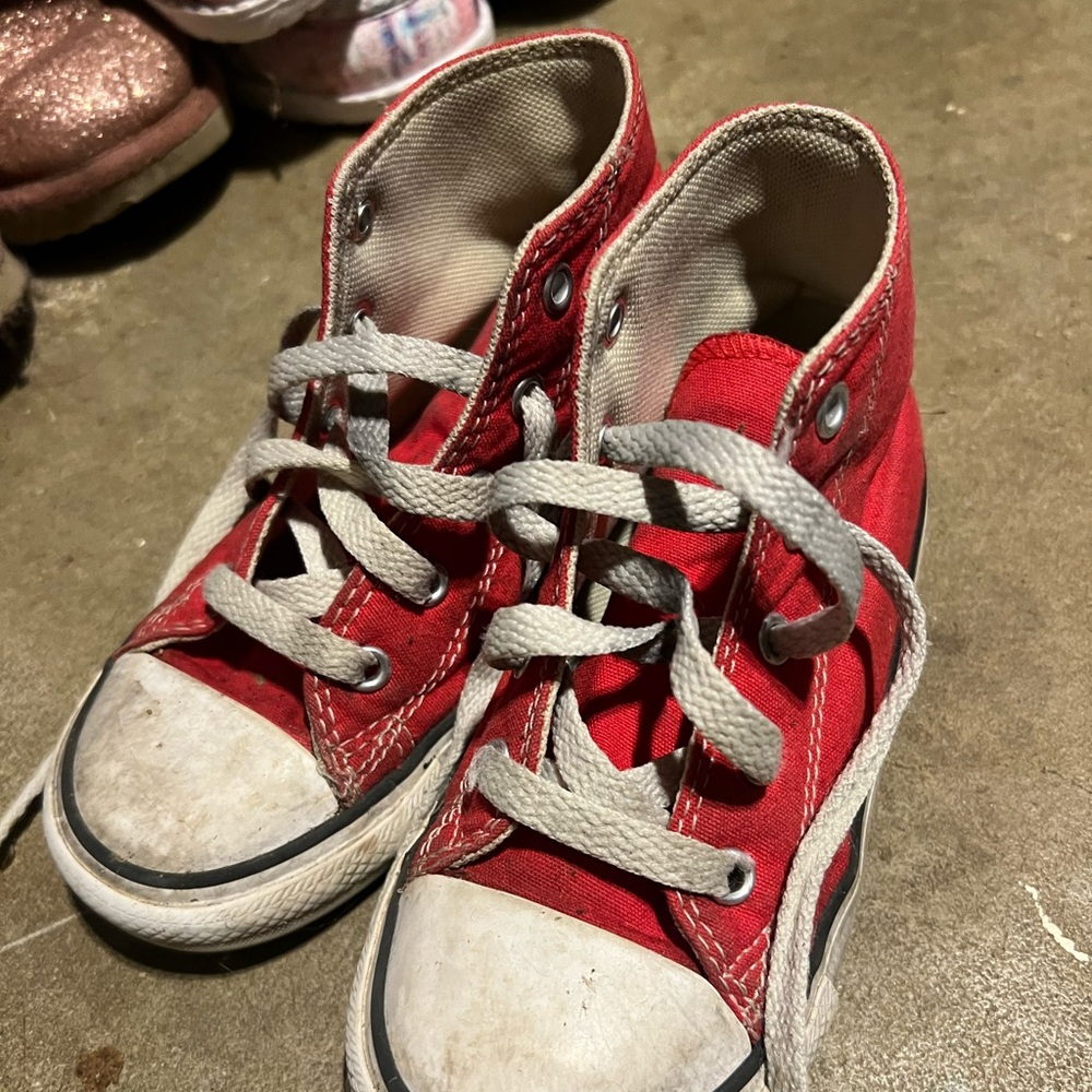 Red kids converse.